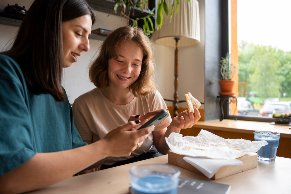 A family member scanning a QR code at a baby shower to contribute to the child’s savings.